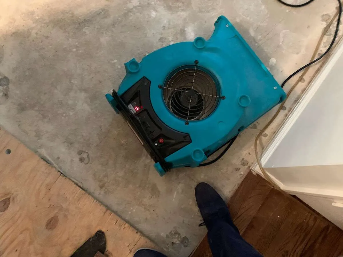 Air mover drying subfloor during Leak Detection & Repair in Carlsbad
